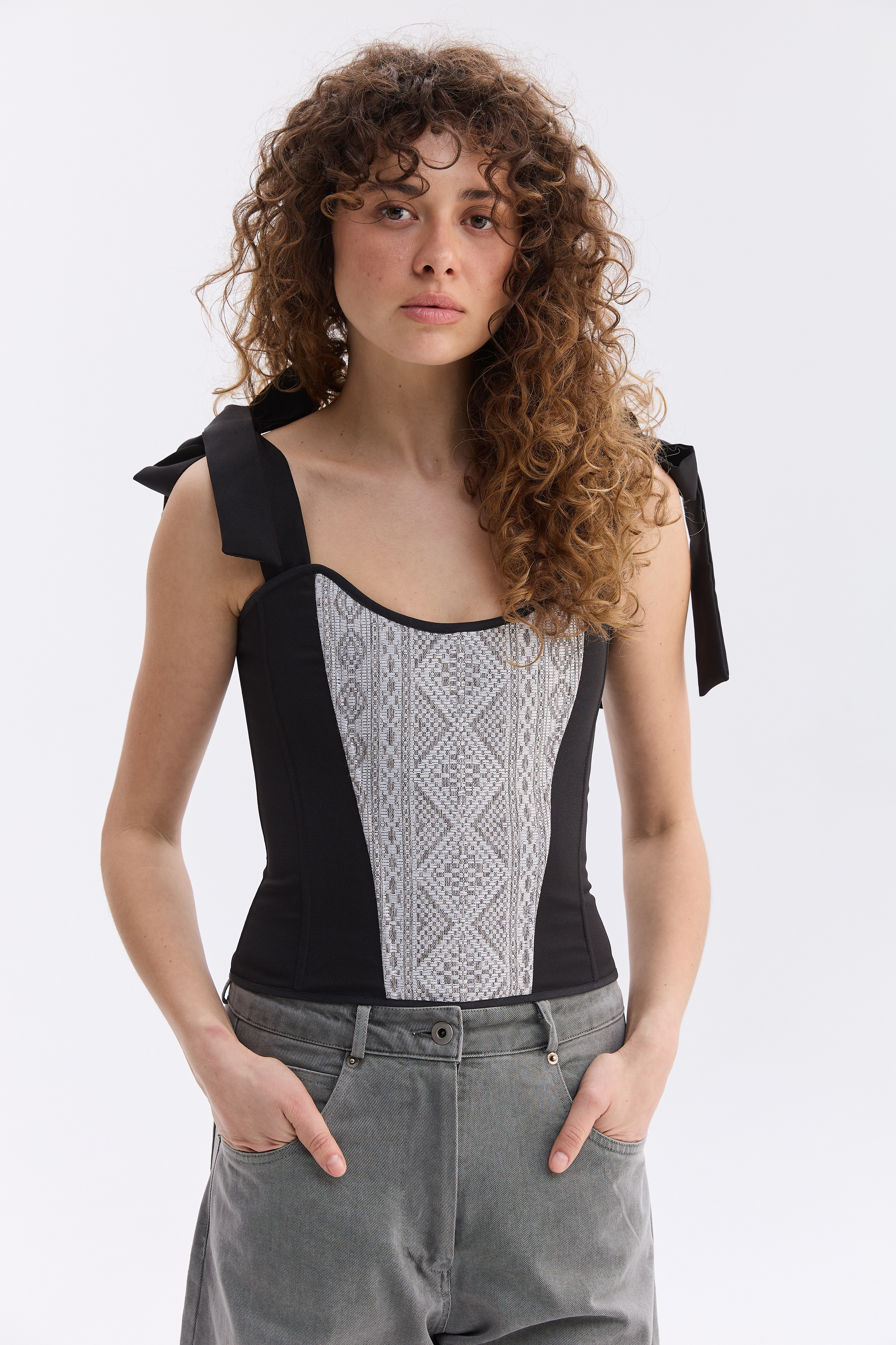 Орнаментований жіночий топ зі шнурівкою