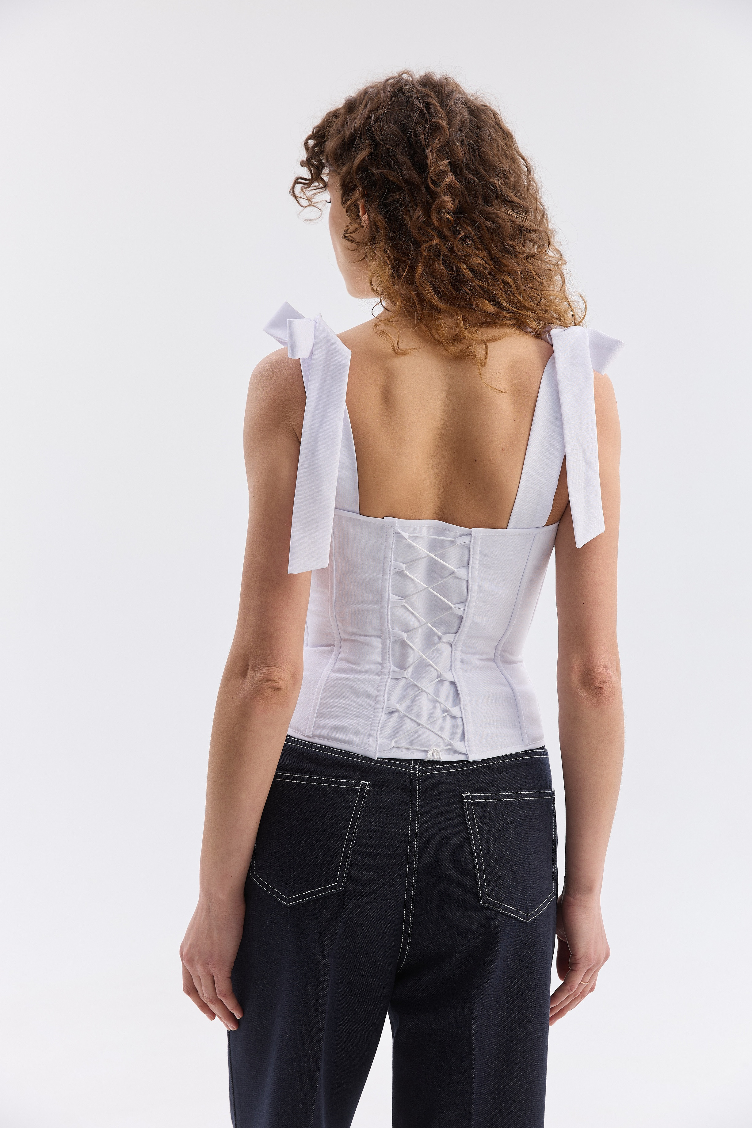 Орнаментований жіночий топ зі шнурівкою